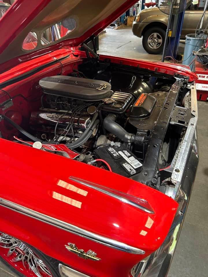 Close-up of 1963 Ford Galaxie chrome and red custom wheels