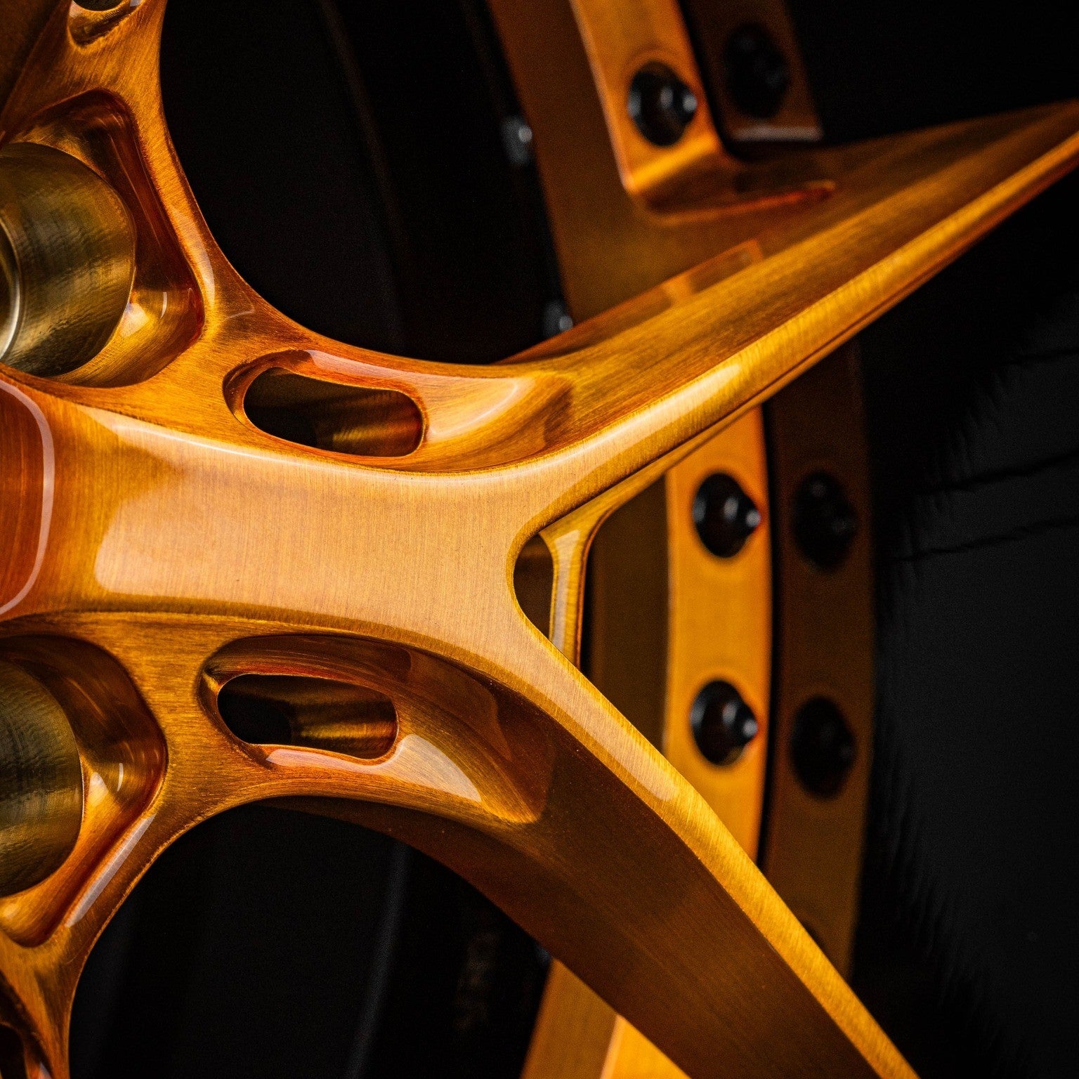Close-up of custom forged DR08D copper black wheels for a 1967 Chevy Camaro by RVRN Wheels.
