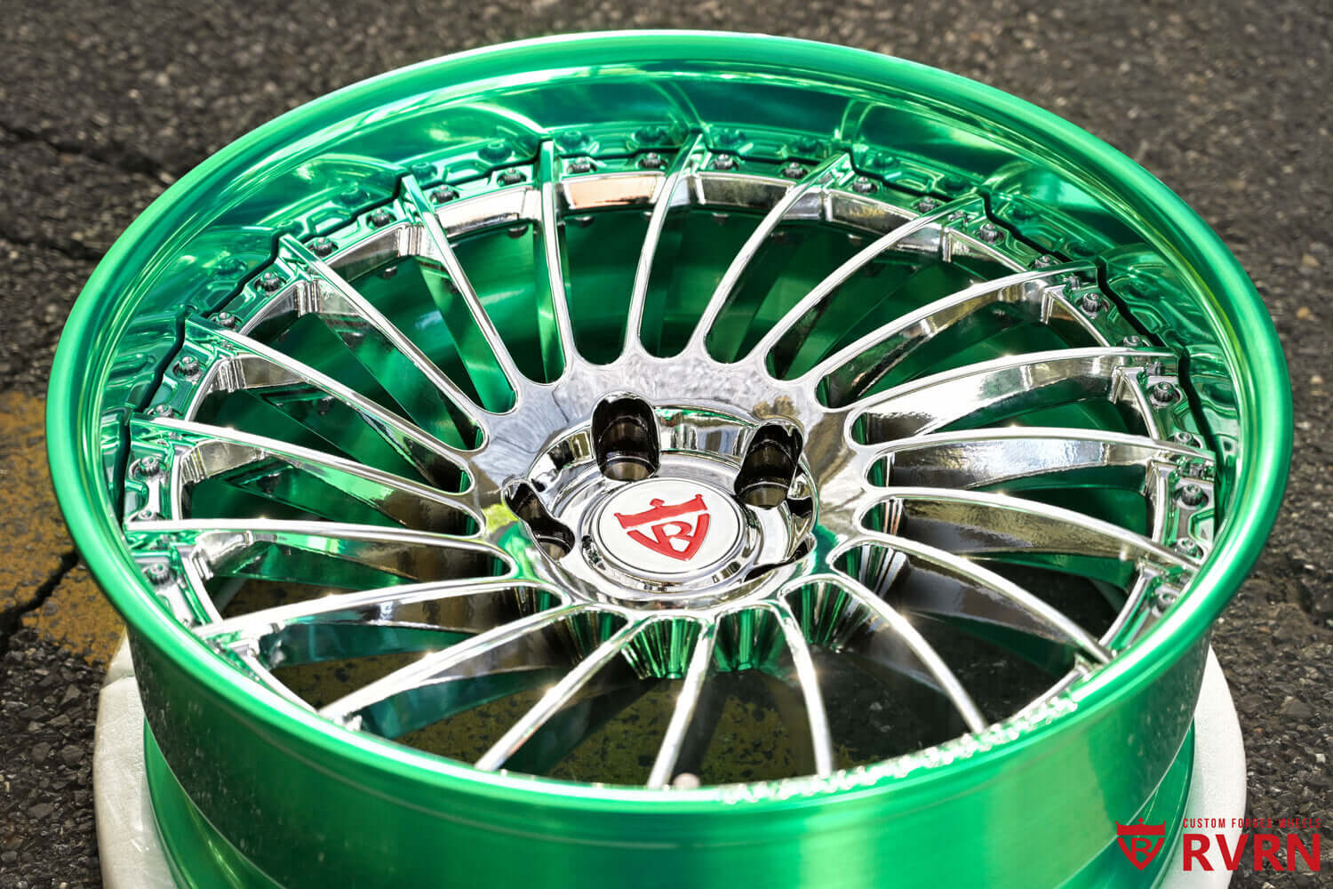 Close-up of RV-DN01 chrome spokes with polished green barrel custom forged wheels