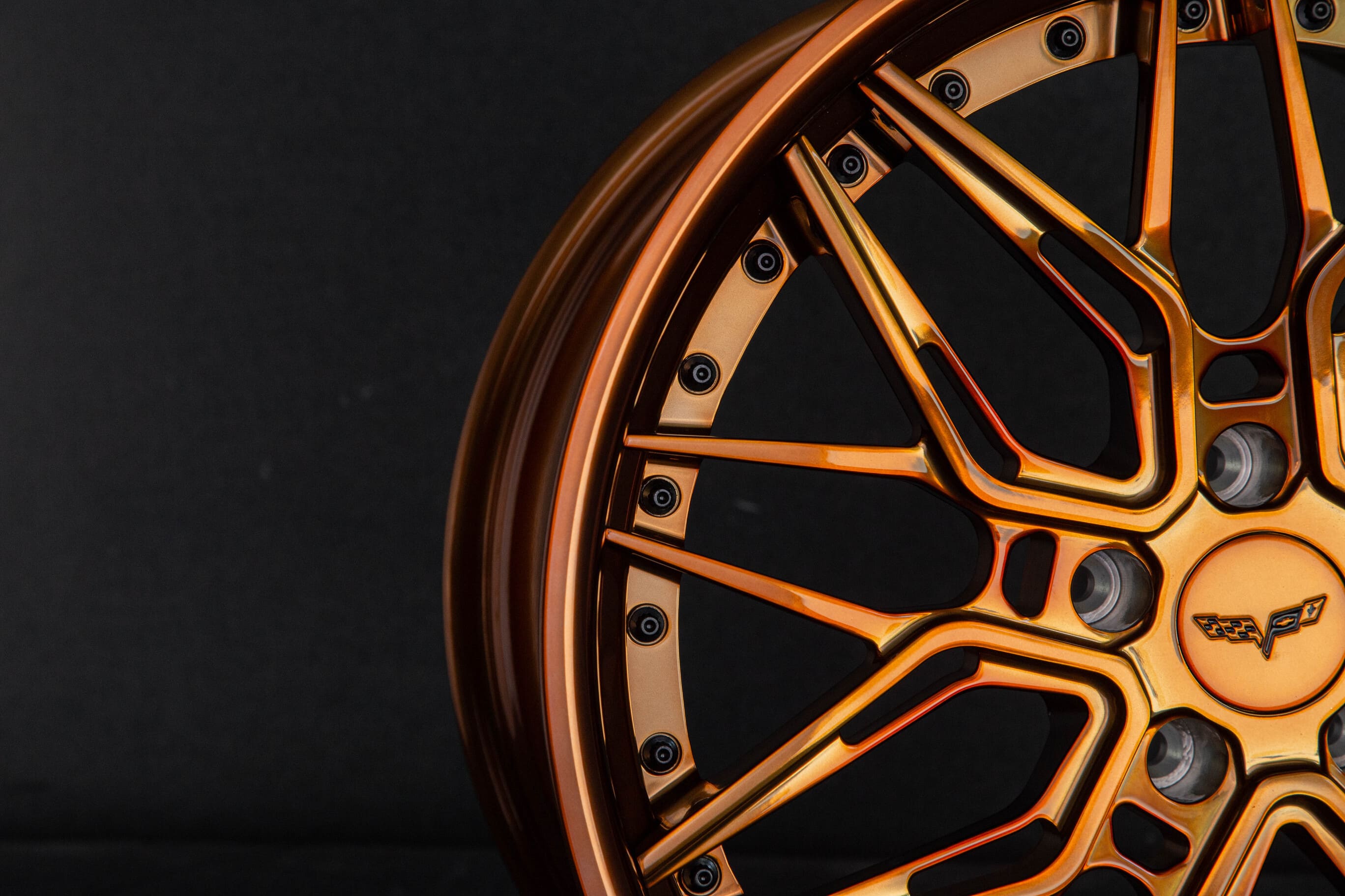 Close-up of polished bronze deep dish C6 Corvette wheels.