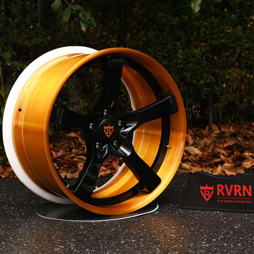 Front view of 2011 Porsche Cayenne with RV-DP223 22-inch custom forged wheels in dark gold barrel and gloss black spokes.
