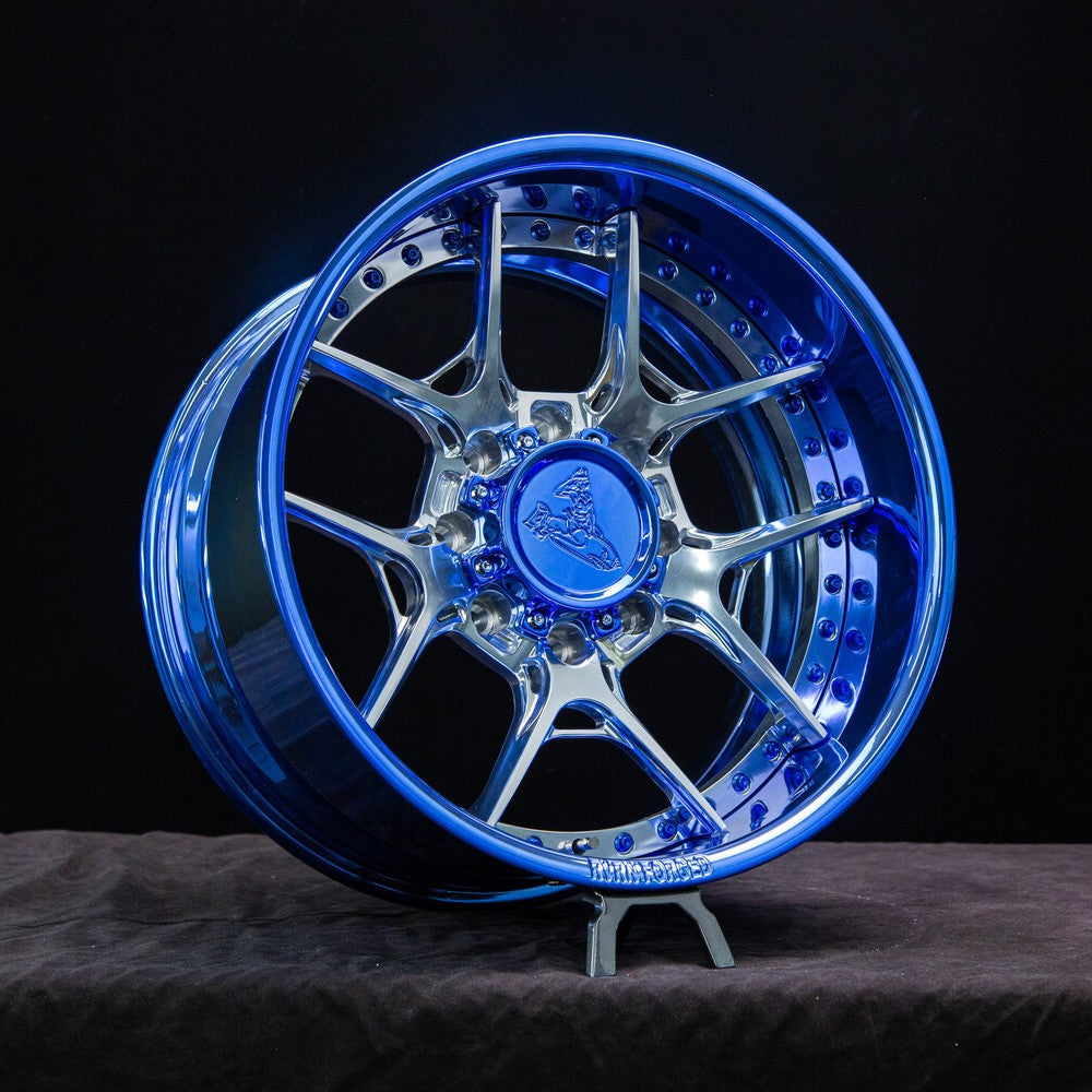 Front view of custom 2012 Ford F250 wheels with blue chrome barrel and polished aluminum spokes