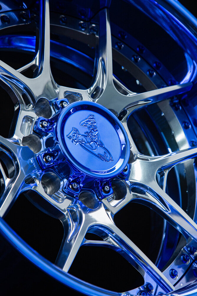 Detailed shot of blue chrome finish on custom 8 lug Ford F250 wheels