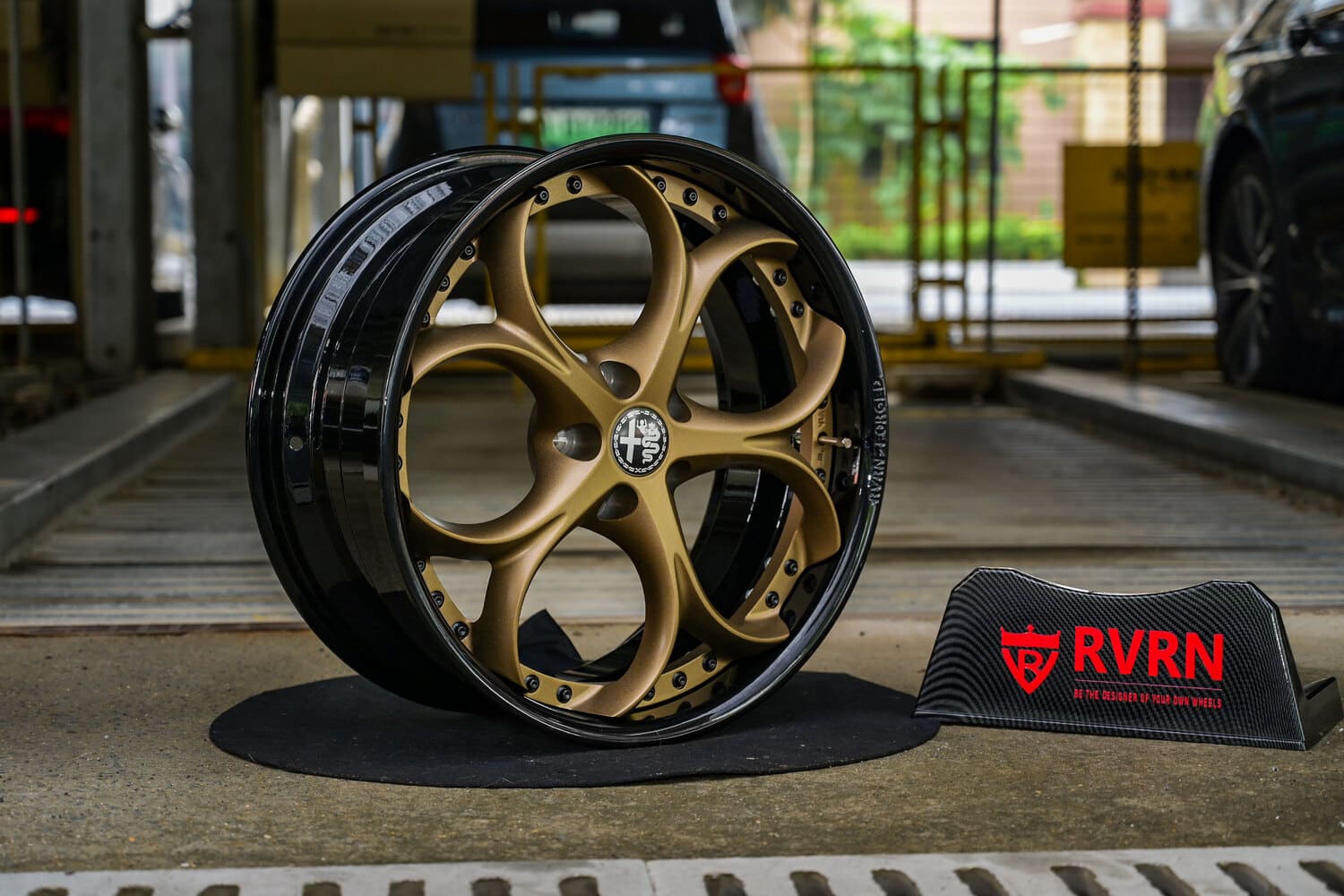 Detailed view of matte bronze spokes on custom Alfa Romeo wheels