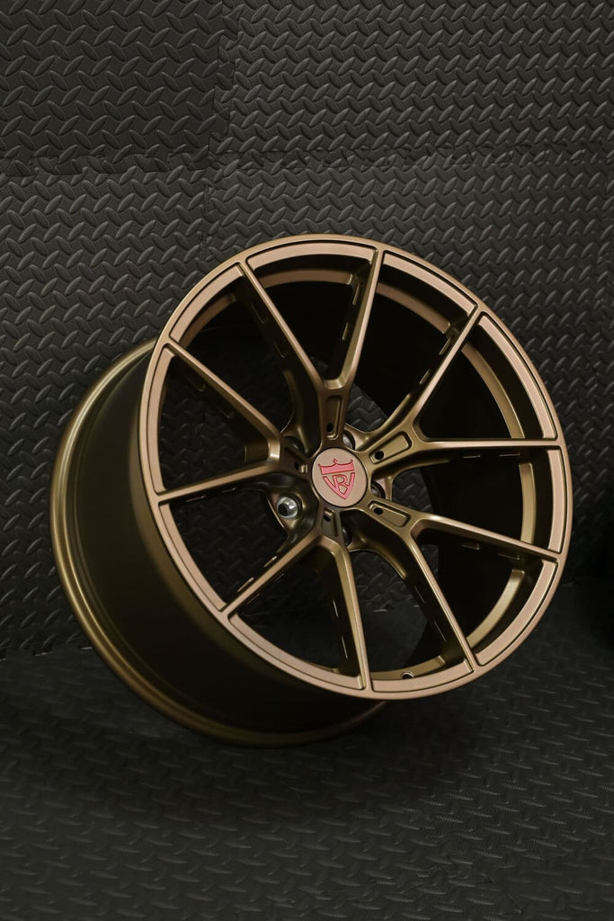 Side angle of custom lightweight matte bronze wheels for Mercedes E550