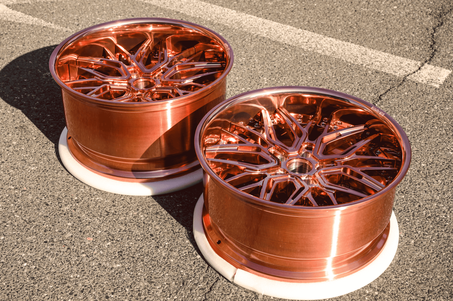 Front angle view of custom 2016 Camaro SS rose gold 20x10 forged wheel by RVRN