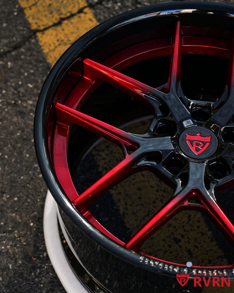 Close-up detail of custom red and black forged C7 Z06 wheels
