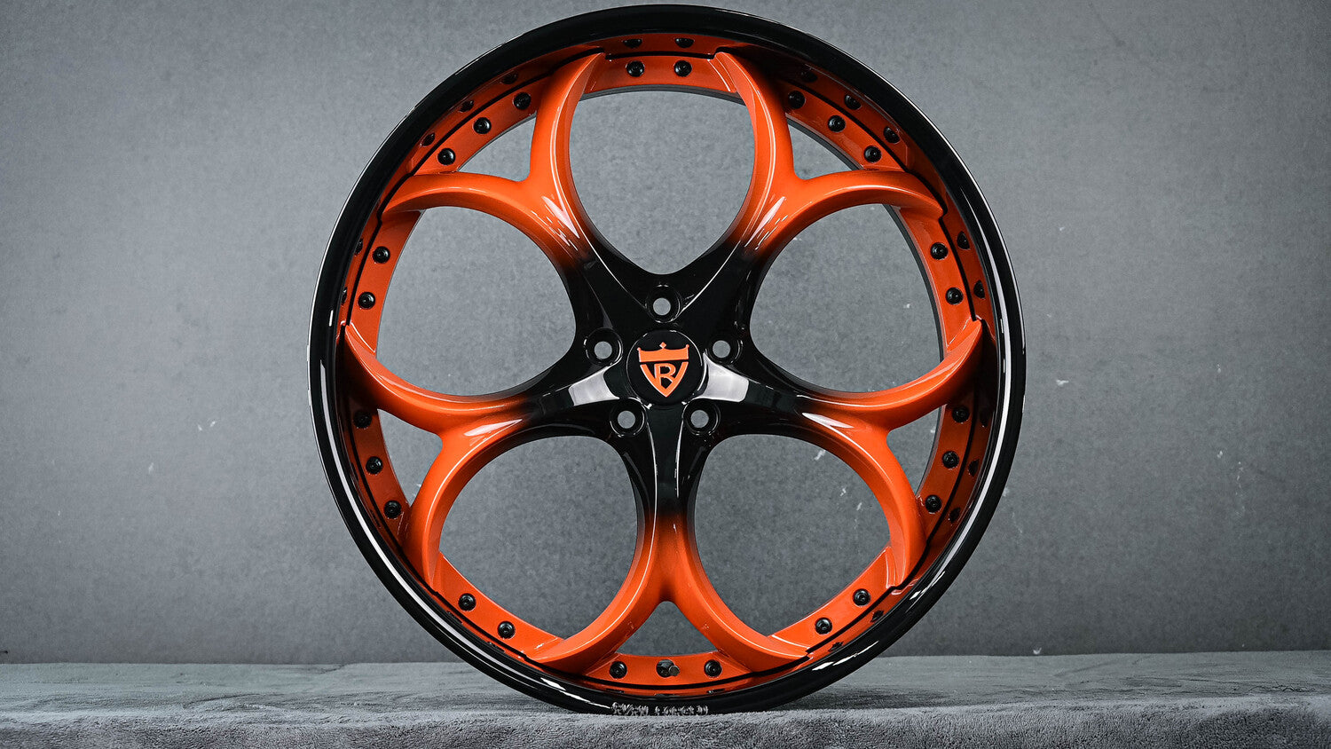 Front angle of Jaguar F Type with RV-DS016 custom wheels in orange fade to black