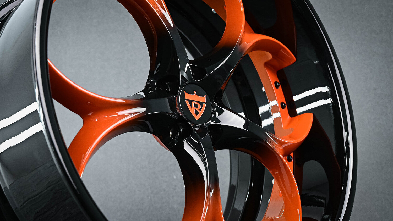22x9J front rim with orange fade to black finish for Jaguar F Type