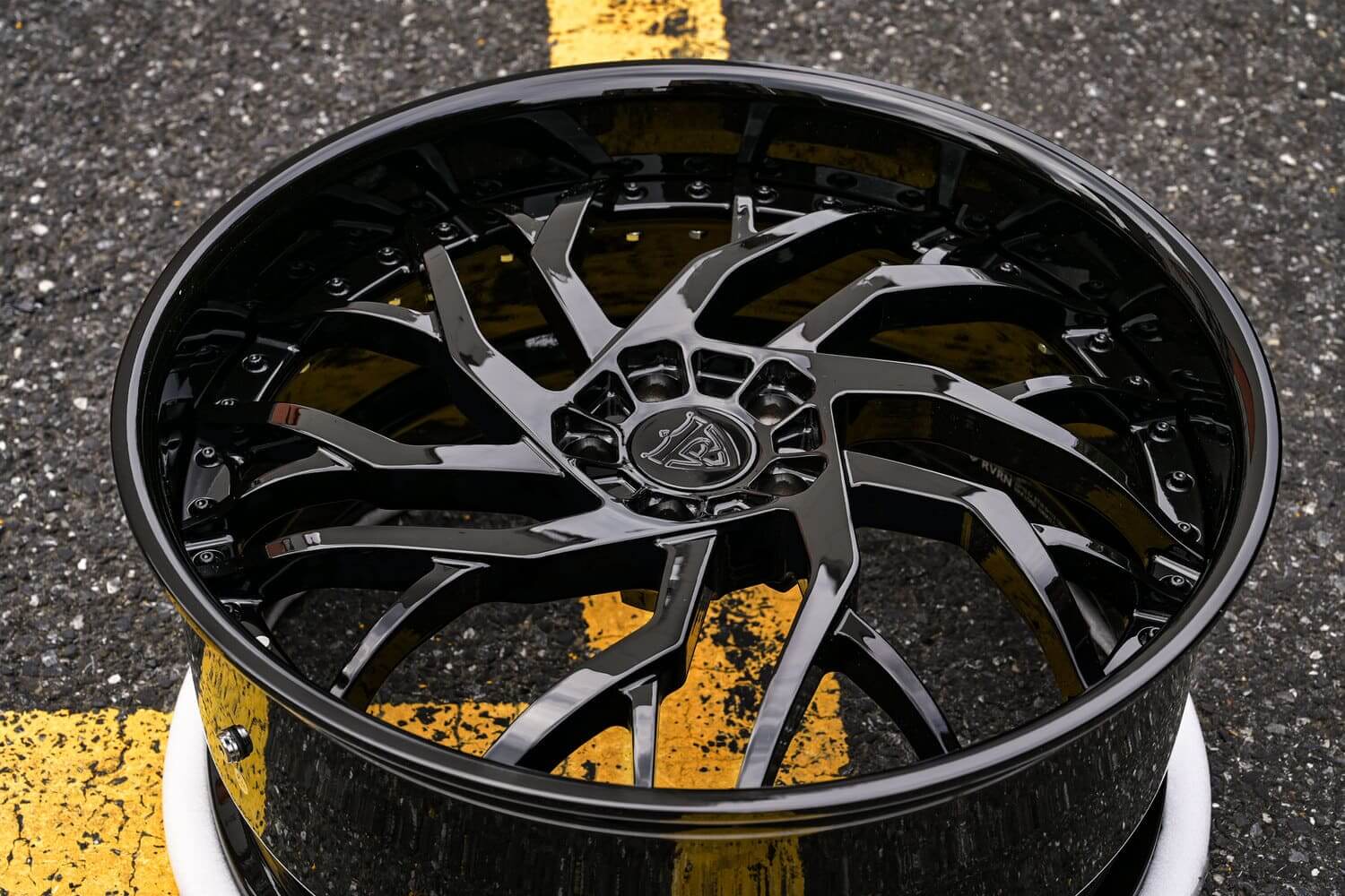 Detailed view of custom forged lip on deep dish AMG wheels