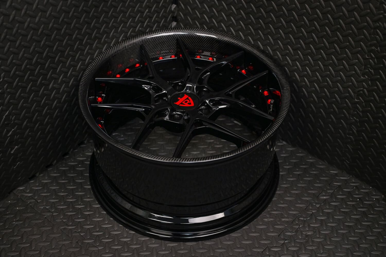 Front angle view of RV-DR08 gloss black forged wheels on 2016 Subaru WRX