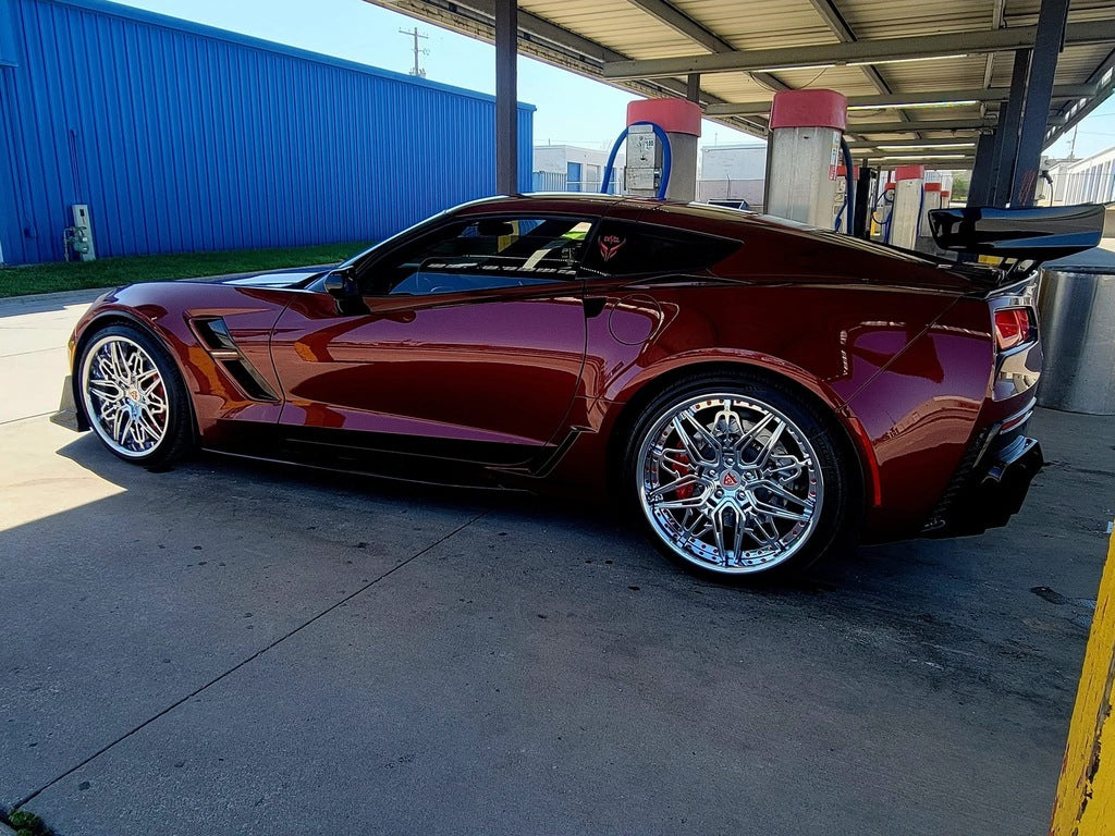 Detailed closeup of RM-01 chrome forged wheels on 2017 C7 Corvette