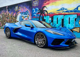 Blue Corvette C8 featuring custom forged 2-piece rims in a vibrant urban setting.