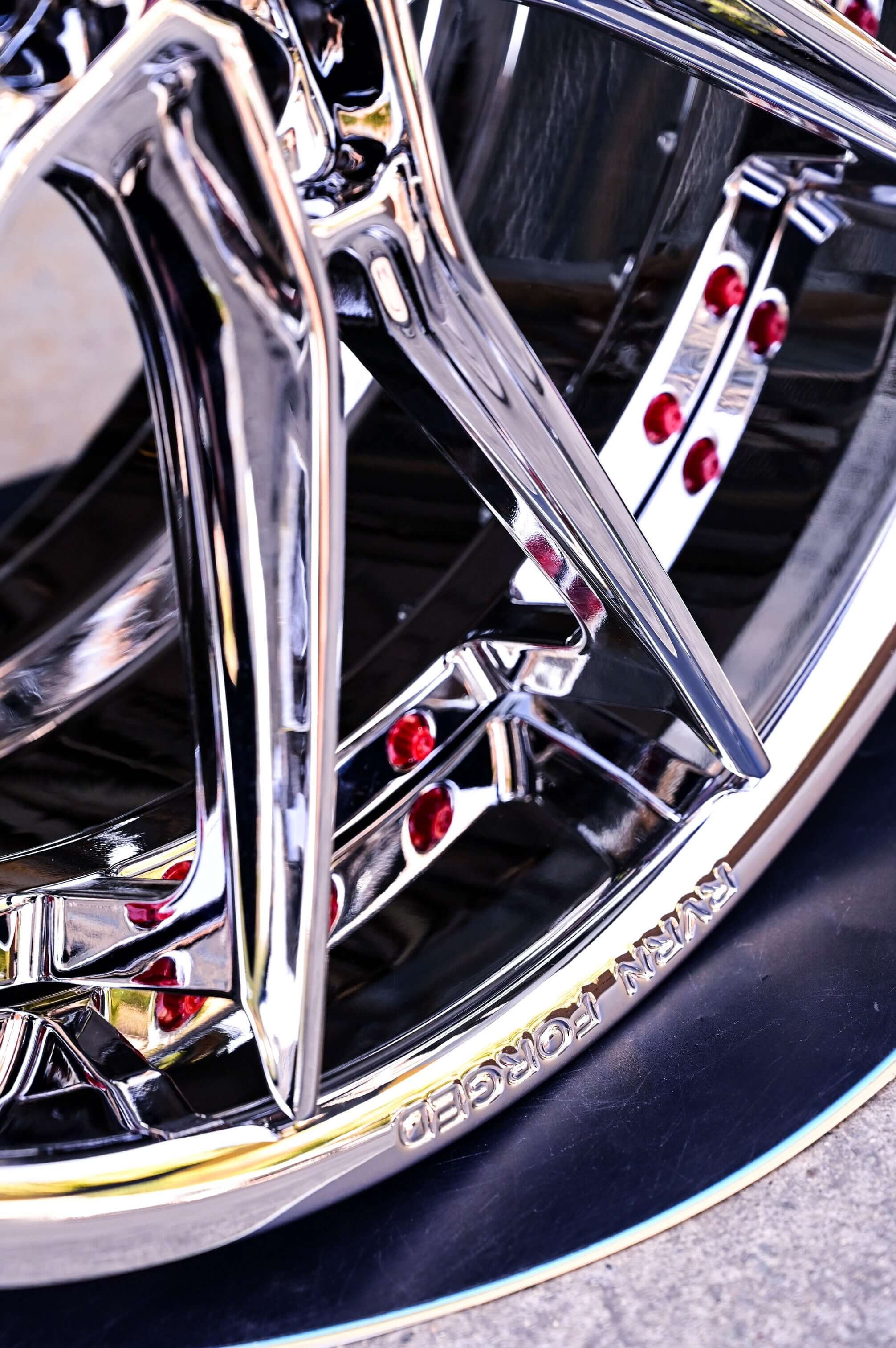 Close-up of chrome wheels for C8 Corvette highlighting design and polished finish, ideal for 2021 Corvette upgrades.