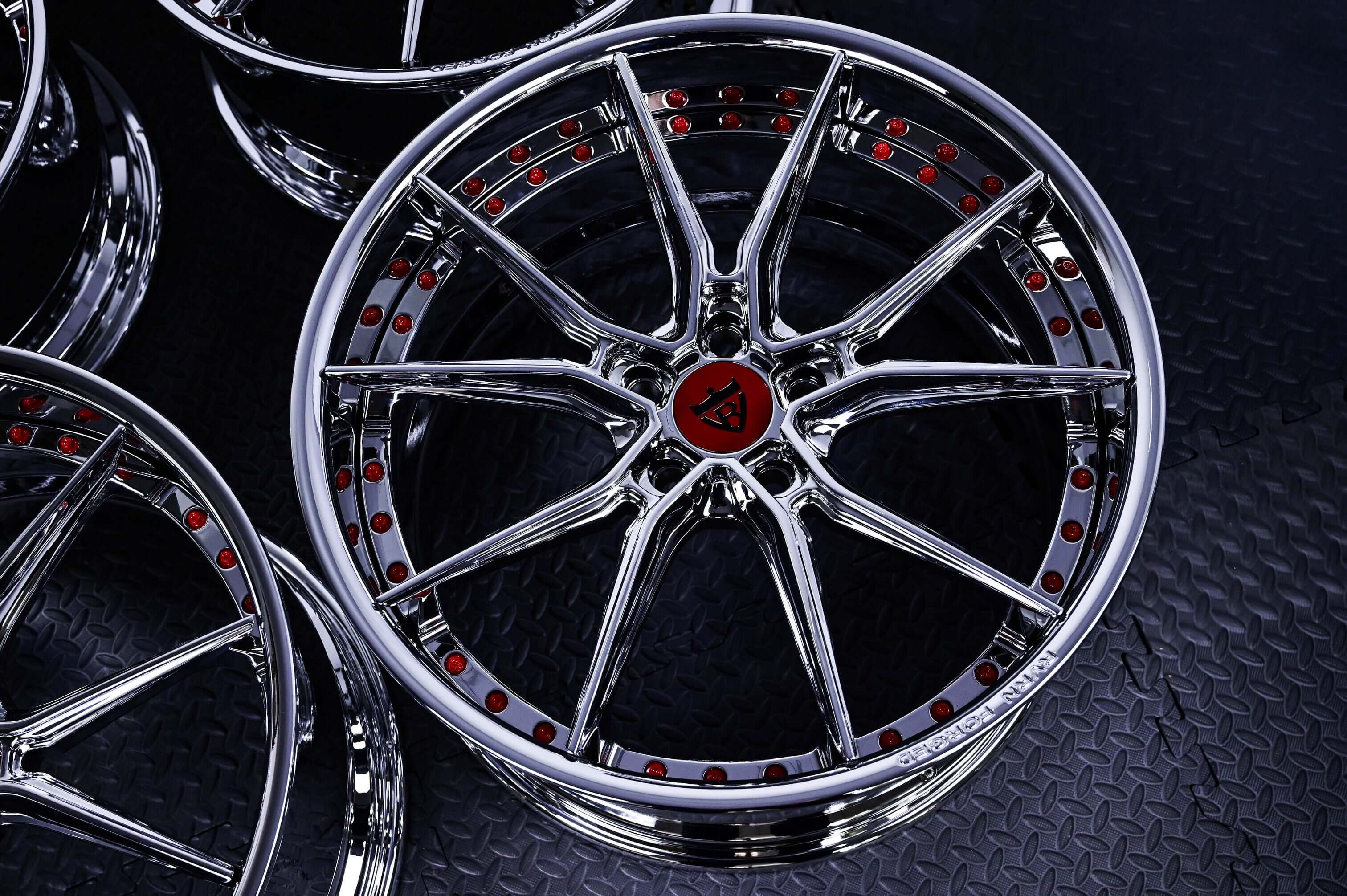 Chrome wheels for C8 Corvette featuring sleek design and red accents, perfect for enhancing 2021 Corvette aesthetics.