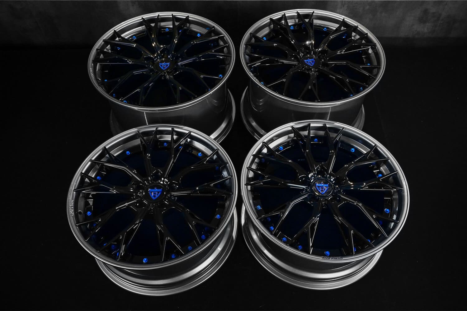 Close-up of gunmetal and black Corvette C8 forged wheels.