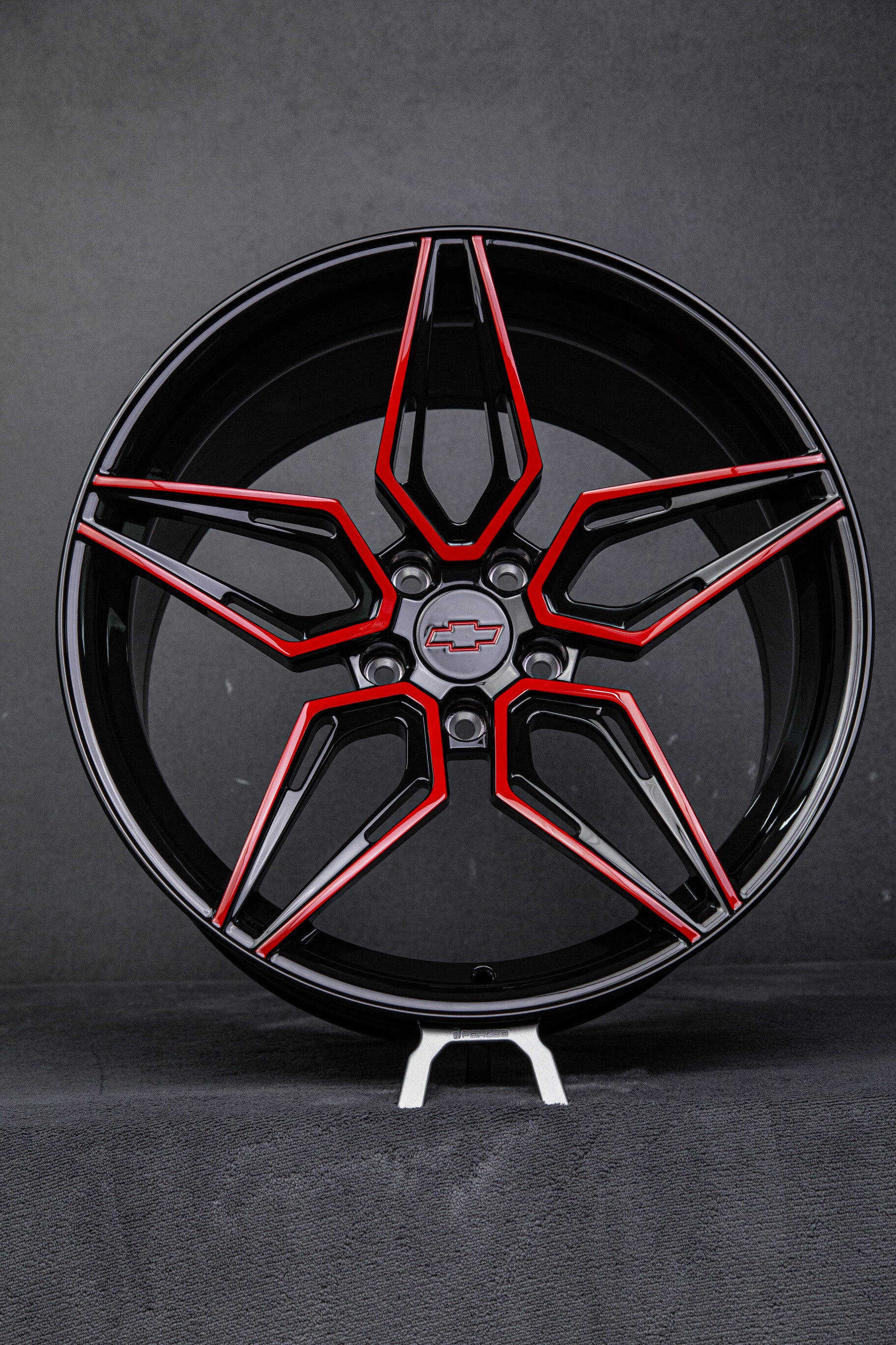 Side profile showing deep concave forged red and black wheels on 2023 Camaro