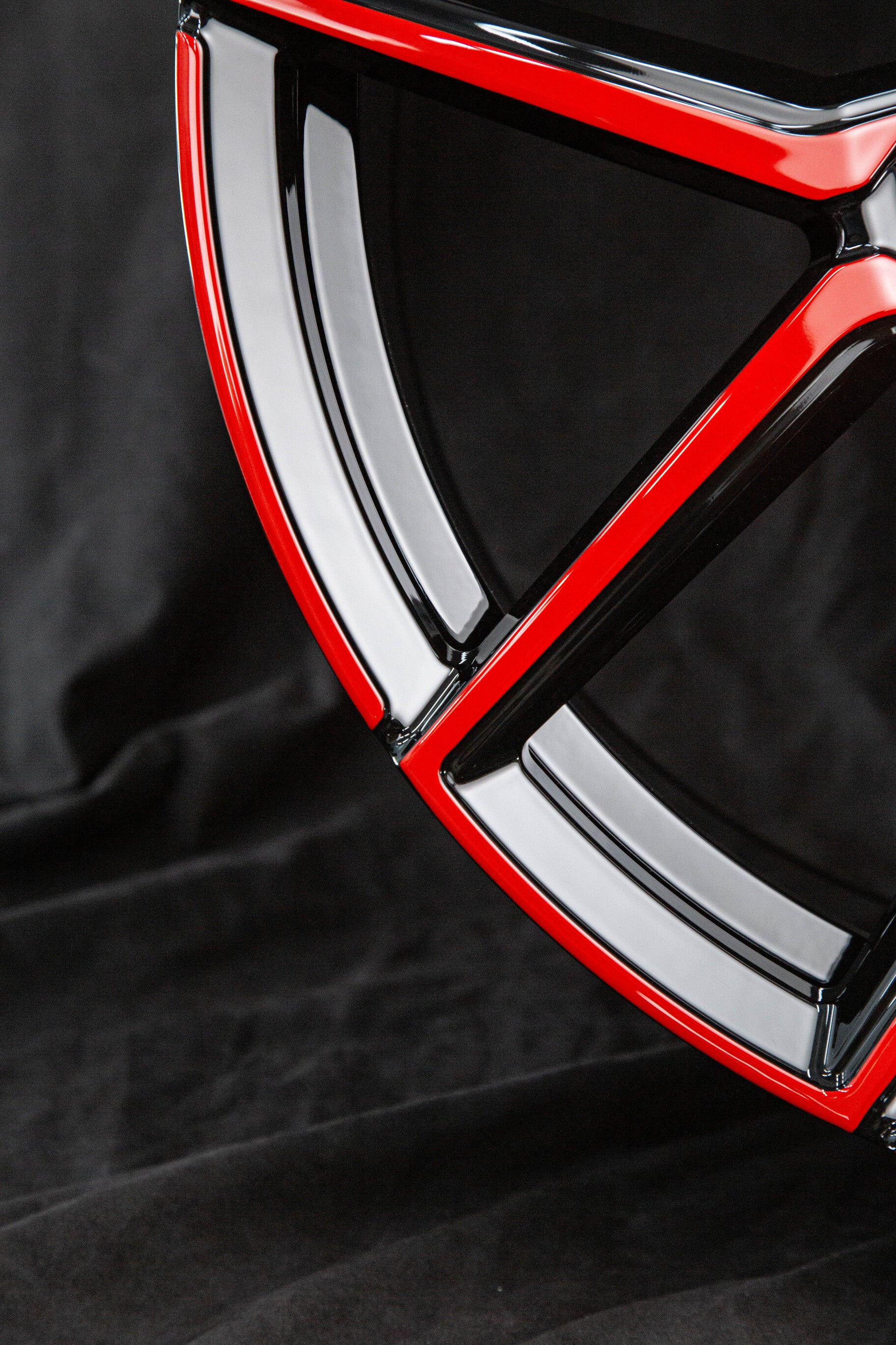 Front view of custom red and black forged wheels for 2023 Corvette C8