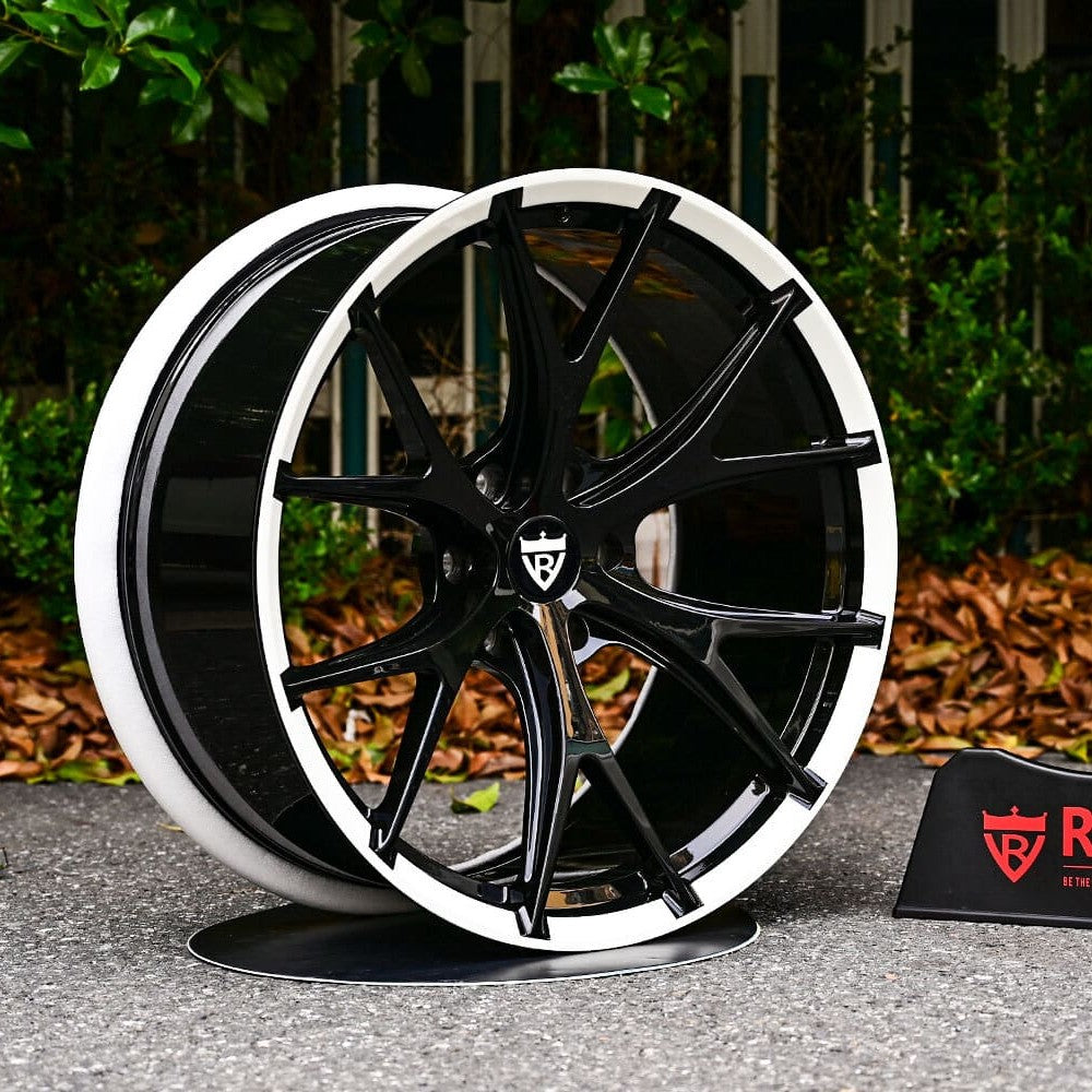 Custom 22 inch forged wheels on 2023 Dodge Ram, gloss black with pearl white lip