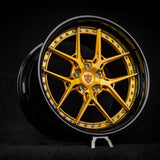 Custom dark gold and black deep dish wheel for Tesla Model S Plaid with 21-inch staggered rim design against a black background.