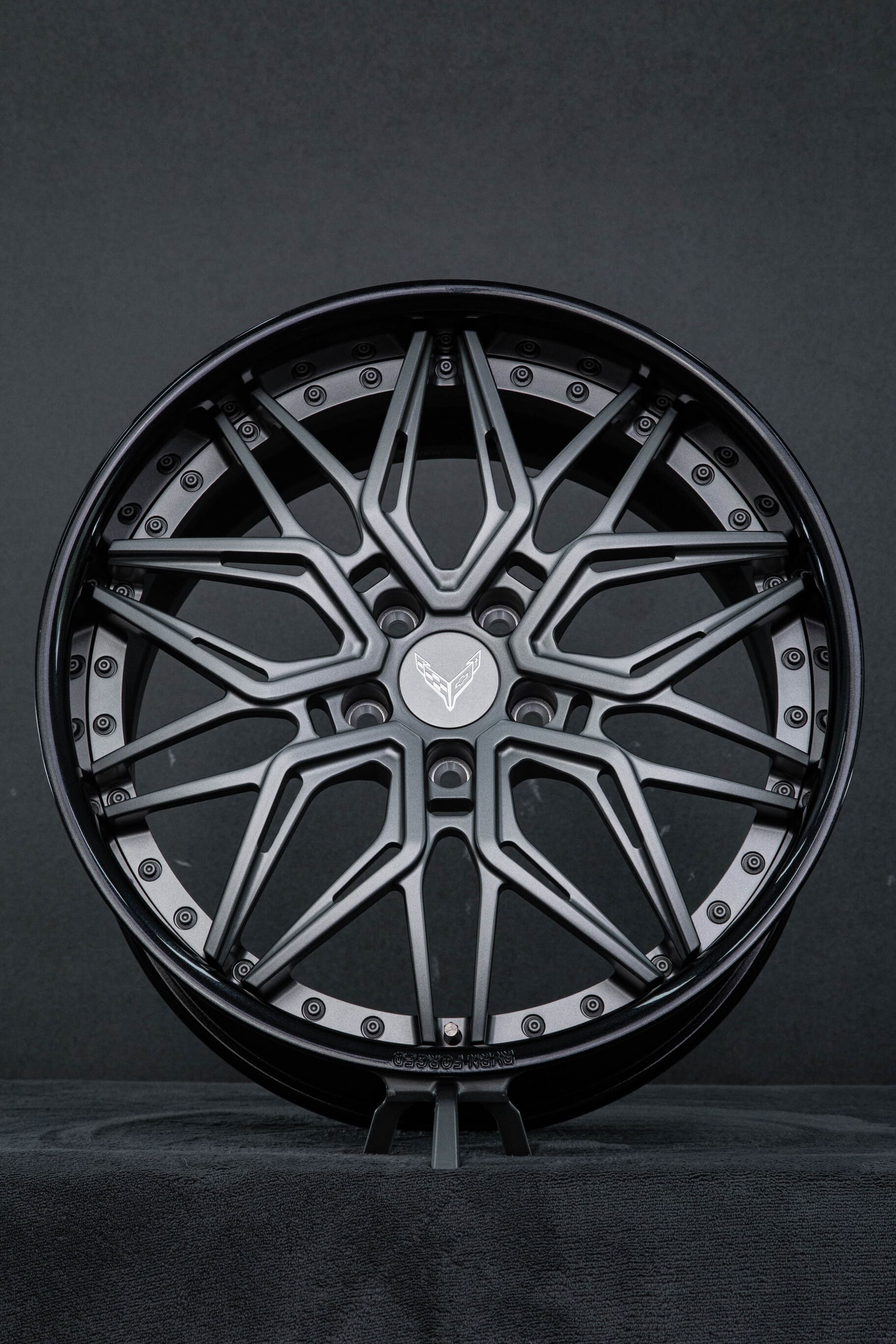 Custom matte gunmetal deep dish Corvette C8 wheel – angled front view