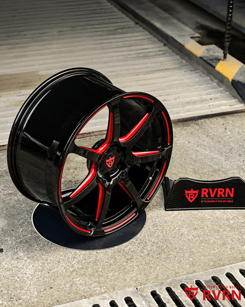 Close-up of black and RVRN red Corvette forged wheels.