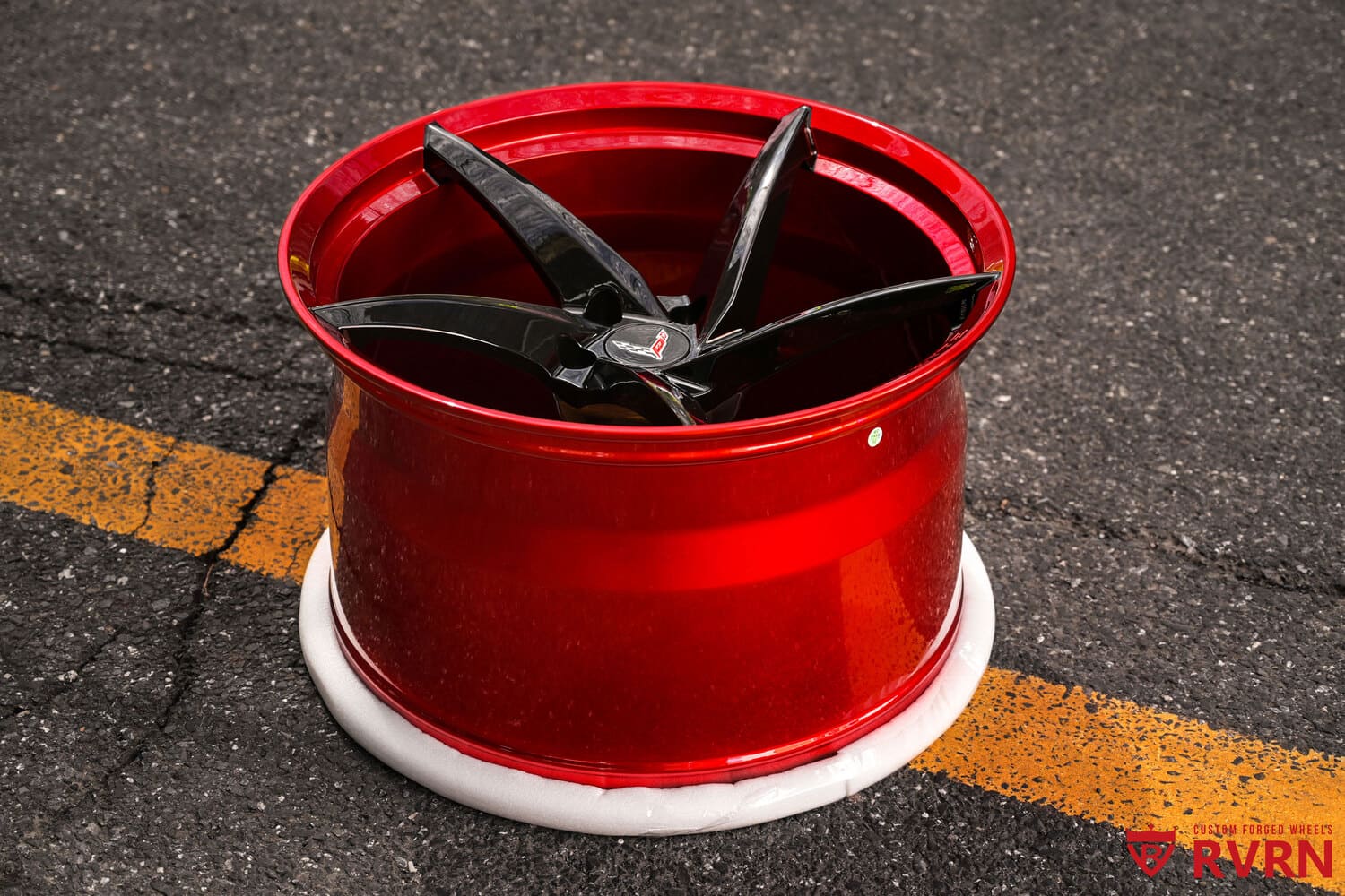 Close-up of gloss black spokes with Black Cherry barrel