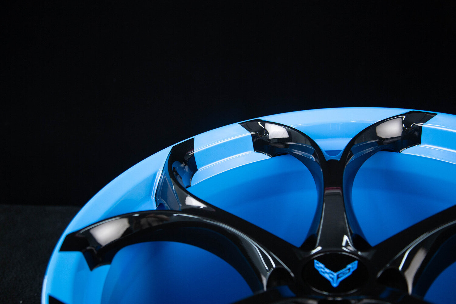 Custom C8 Corvette wheels with color-matched Rapid Blue barrel forged design