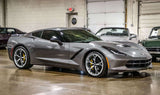 Silver Corvette C8 with custom forged 2-piece rims showcasing deep lip design and high-performance tires.