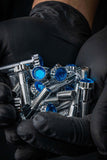 Gloved hands holding Crystal Shiny Screws, ideal for Dodge Dakota R/T wheels and custom 6 lug rims, available in 17 to 26 inches.