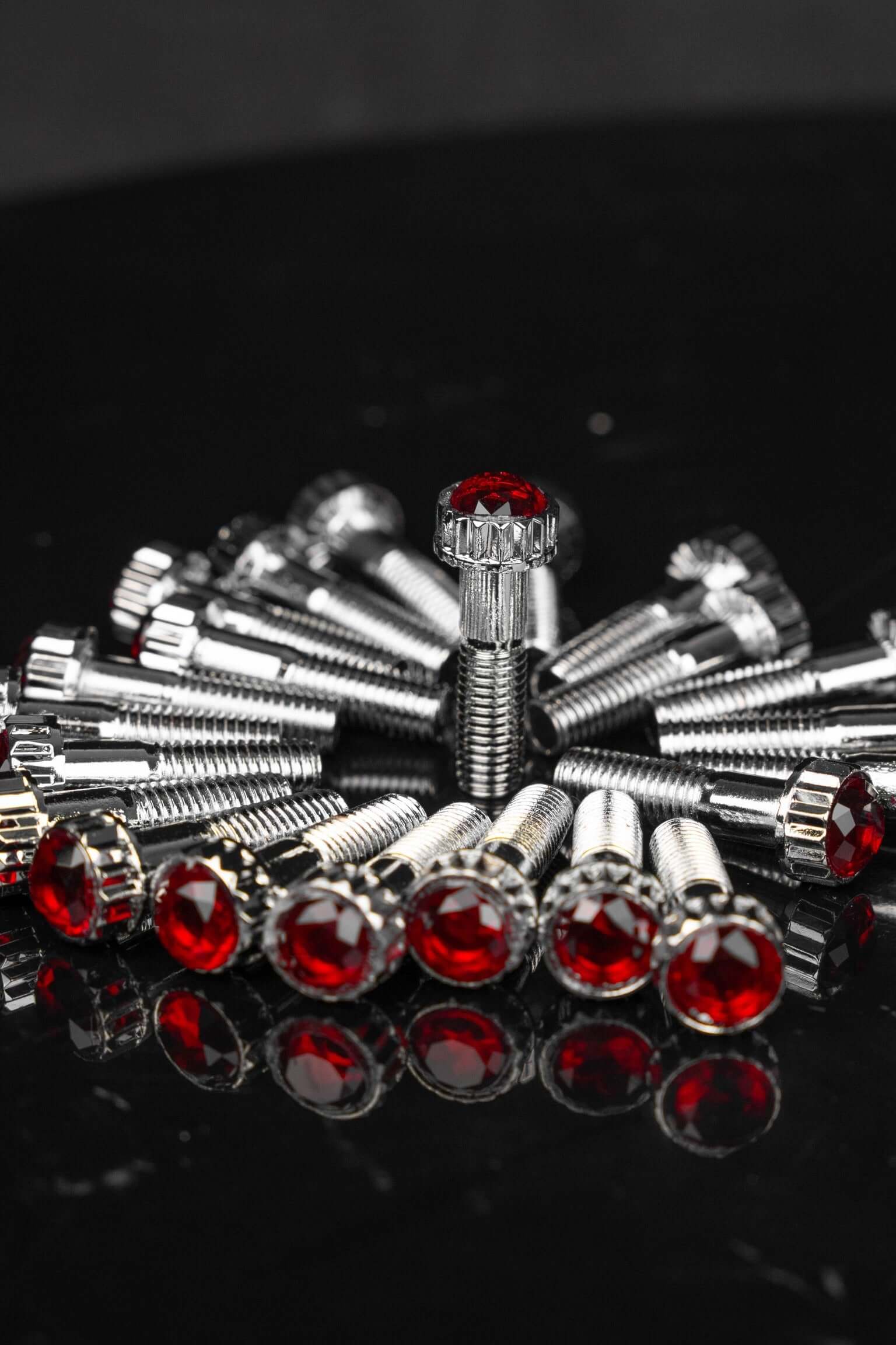 Crystal Shiny Screws with red rhinestones for Dodge Dakota R/T wheels and custom 6 lug rims, available in 17inch-26inch sizes on black background