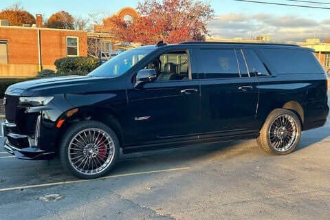 Black GMC Yukon with custom forged wheels showcasing truck black chrome design, perfect for luxury styling.