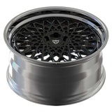 Custom forged 2-piece wheel design with a deep lip, featuring a black intricate mesh and polished finish, ideal for high-performance vehicles.