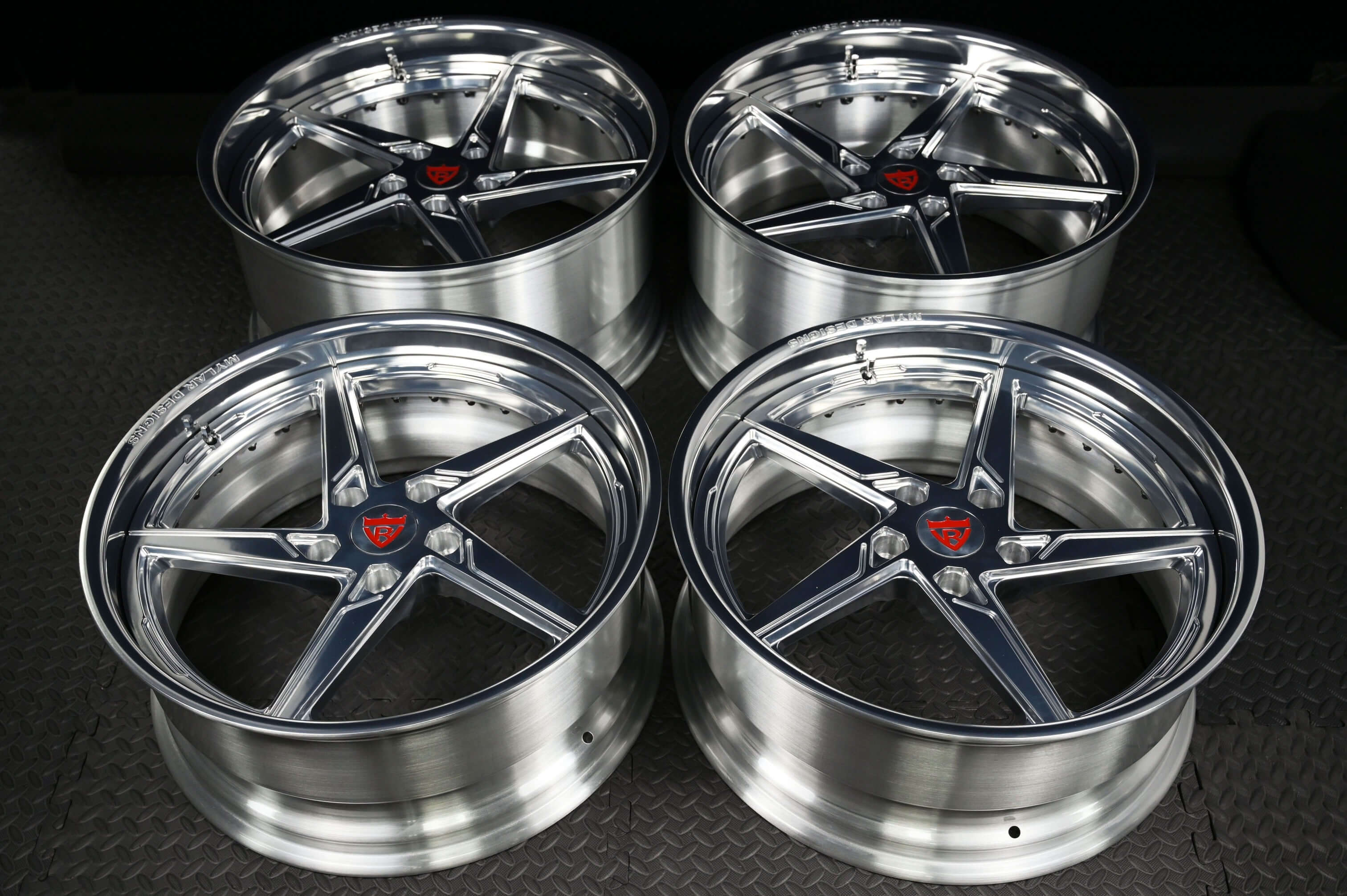 Set of four custom forged Porsche Cayman wheels featuring a 5-spoke deep lip design. Perfect for enhancing performance.