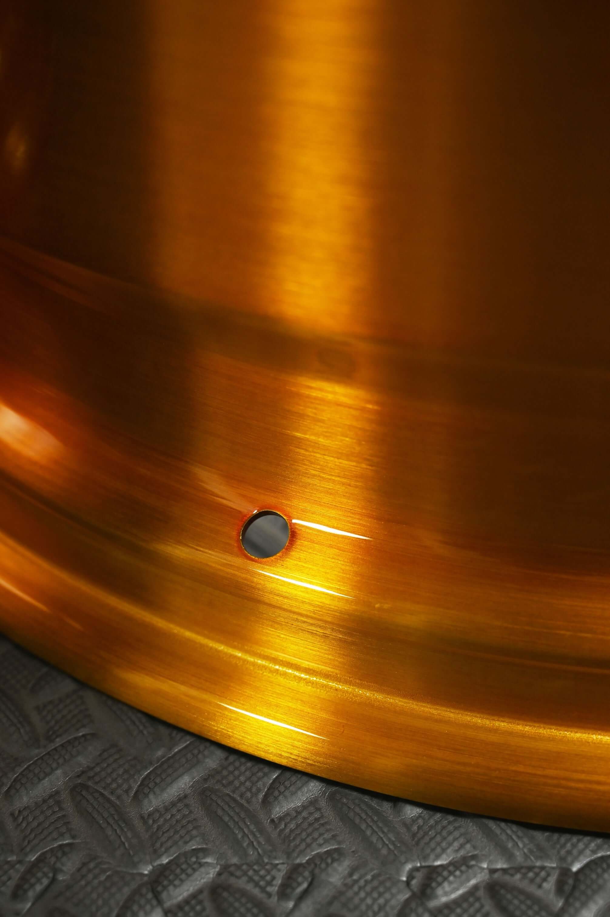 Detail shot of RV-DP223 wheel: transparent dark gold barrel and gloss black 5-spoke forged construction