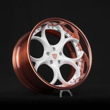 Custom forged deep dish wheel with copper and white finish, showcasing unique design for high-performance vehicles.