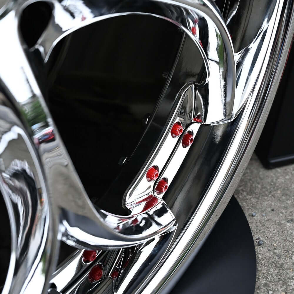 Close-up of custom forged wheels showcasing chrome finish and precision machined details, perfect for corvette C8 aftermarket rims.