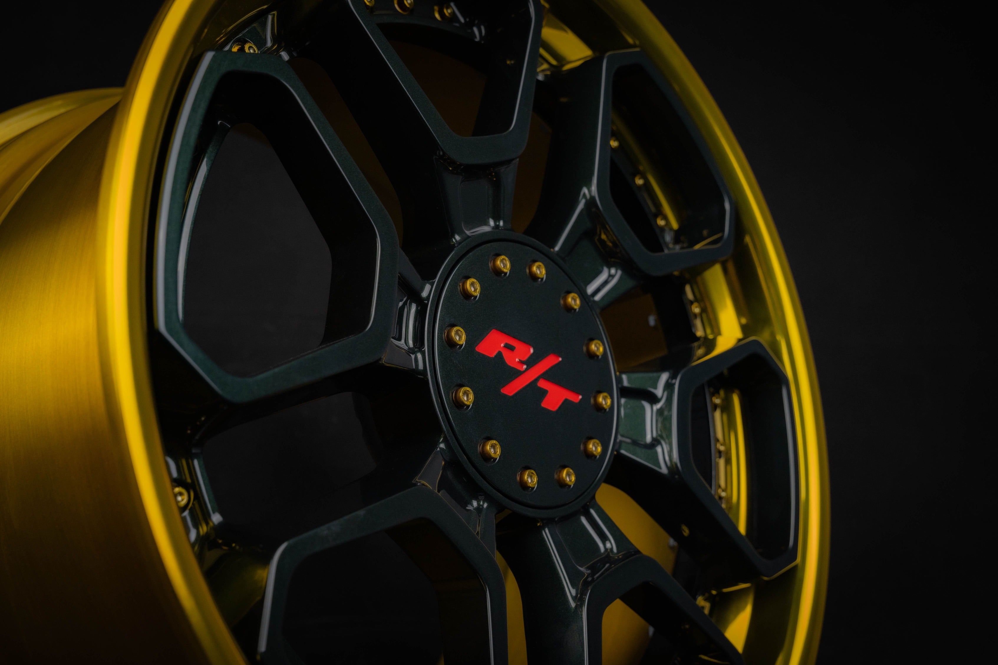 Close-up of black and gold Dakota RT wheels for Dodge Dakota with 6 lug design.