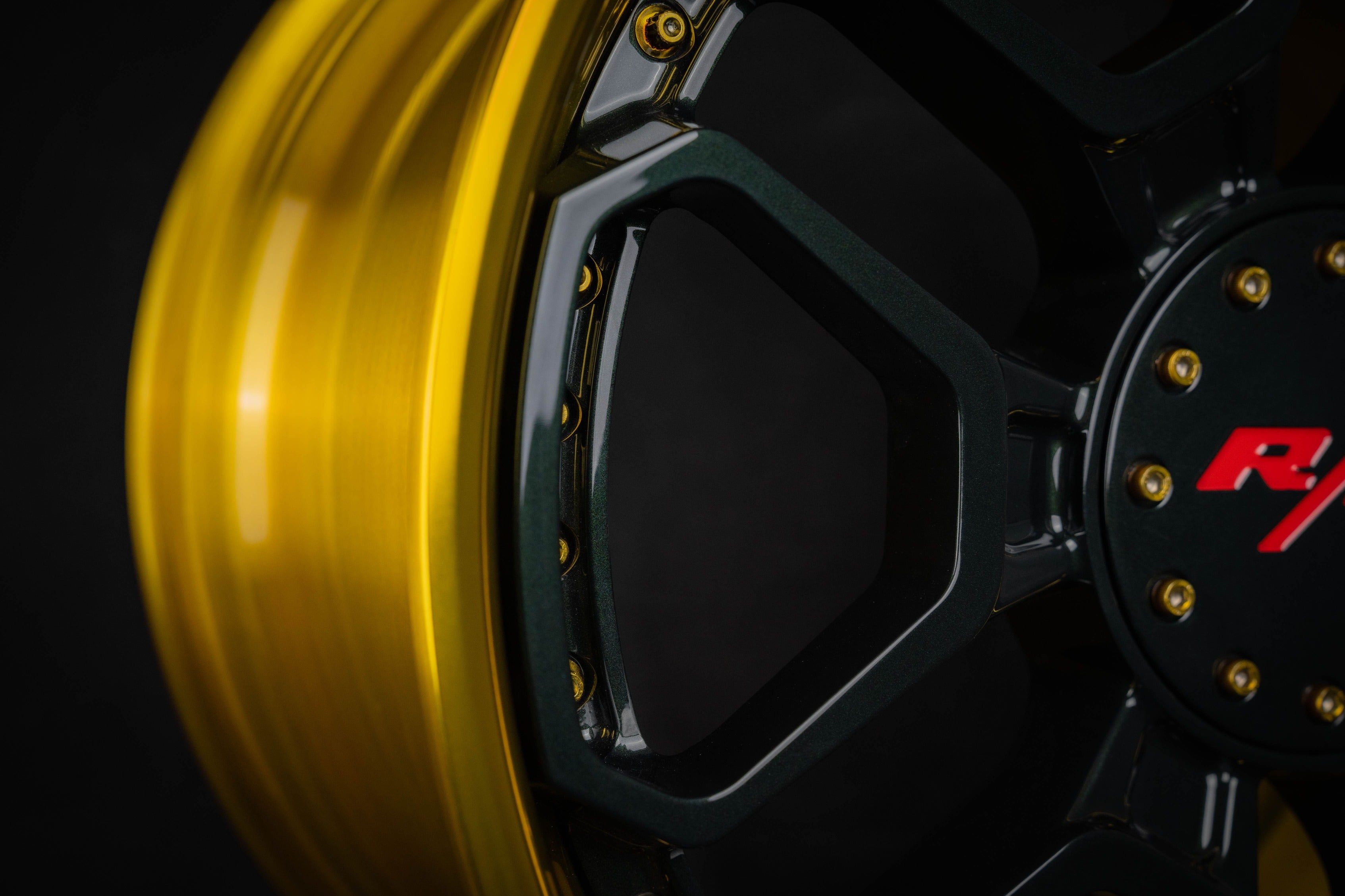 Close-up of a Dakota RT wheel on a Dodge Dakota with a 6 lug wheel pattern, featuring a sleek yellow rim and black spokes.
