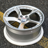 Custom forged monoblock wheel with 5 spokes and a polished silver finish, designed for high-performance vehicles.
