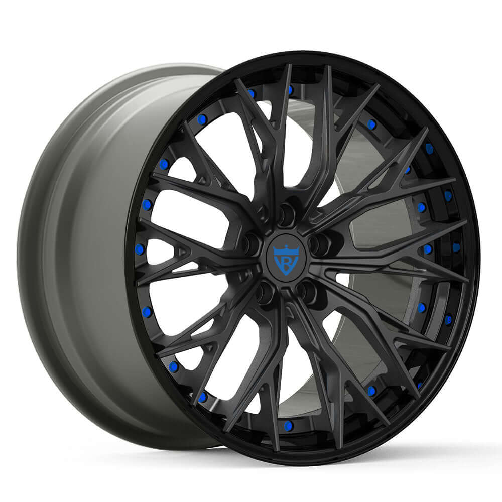 Custom forged RV-DC04 wheels featuring a sleek black finish with blue accents, designed for aggressive styling and performance.