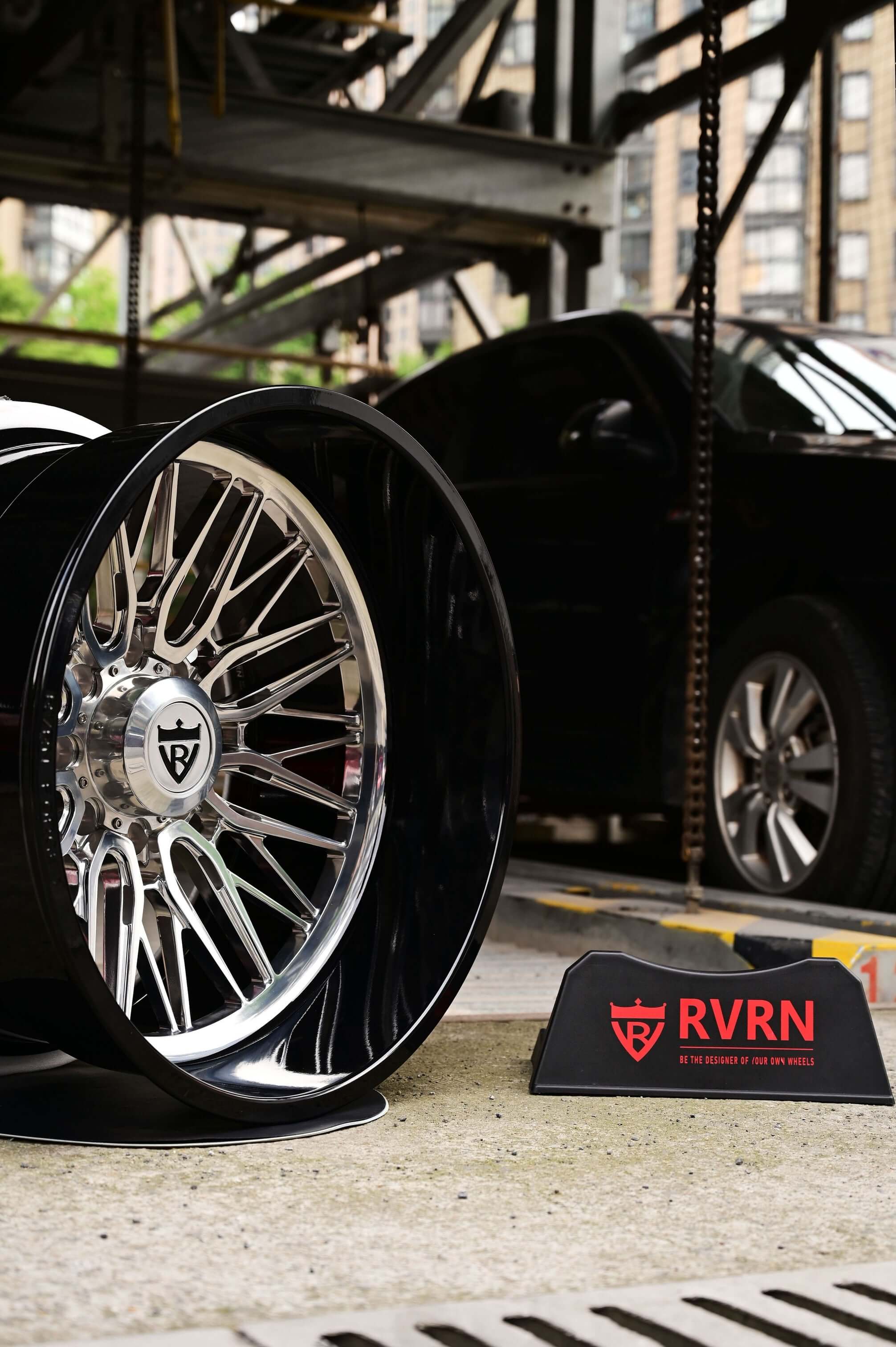 24 inch deep lip rims for GMC truck showcased with RVRN branding in an urban setting, emphasizing custom GMC Sierra wheels.