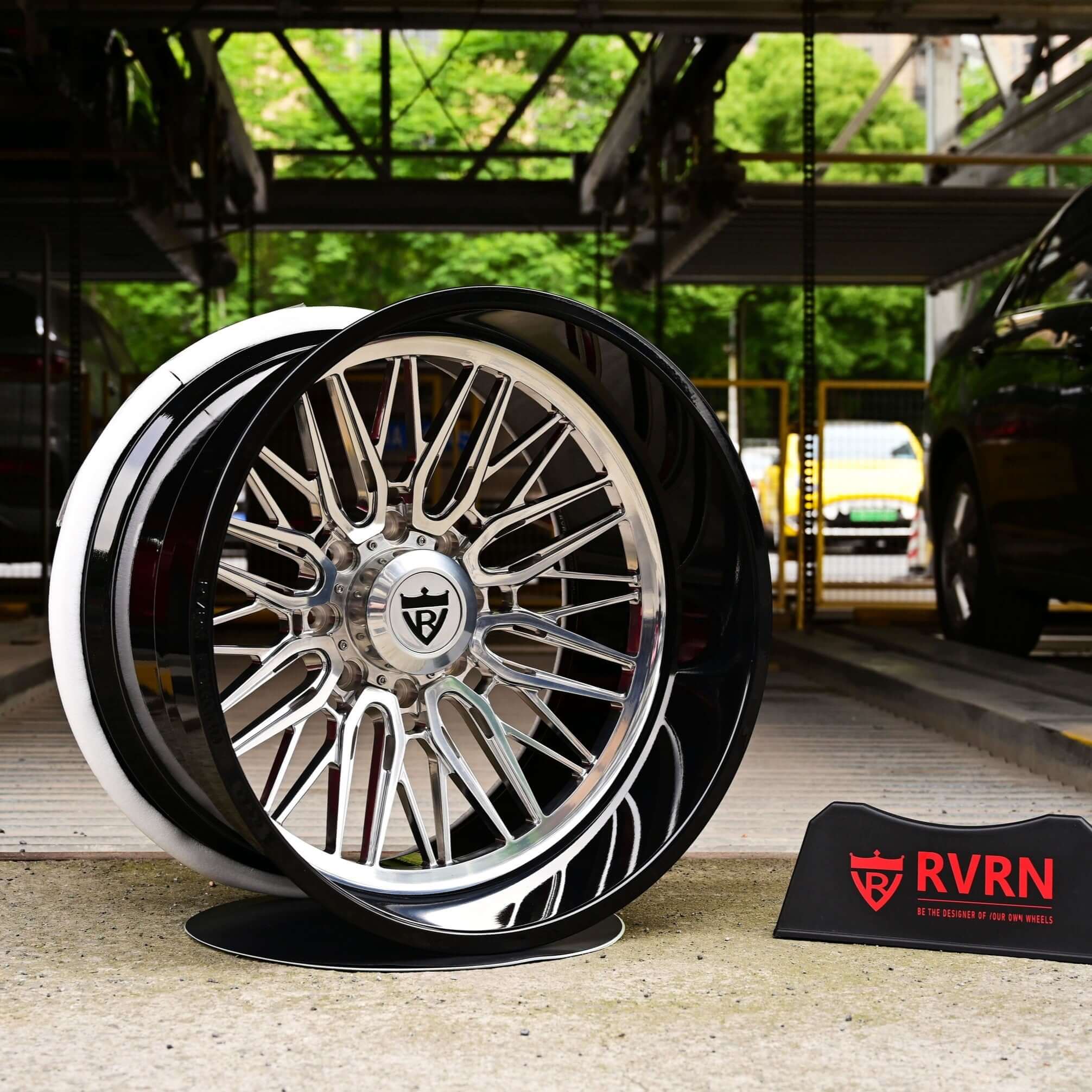 24-inch deep lip rims for GMC Sierra and trucks, showcasing stylish custom wheels with RVRN logo in a garage setting.