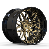View of RVRN 3-piece forged gold wheels for a sports car on a race track