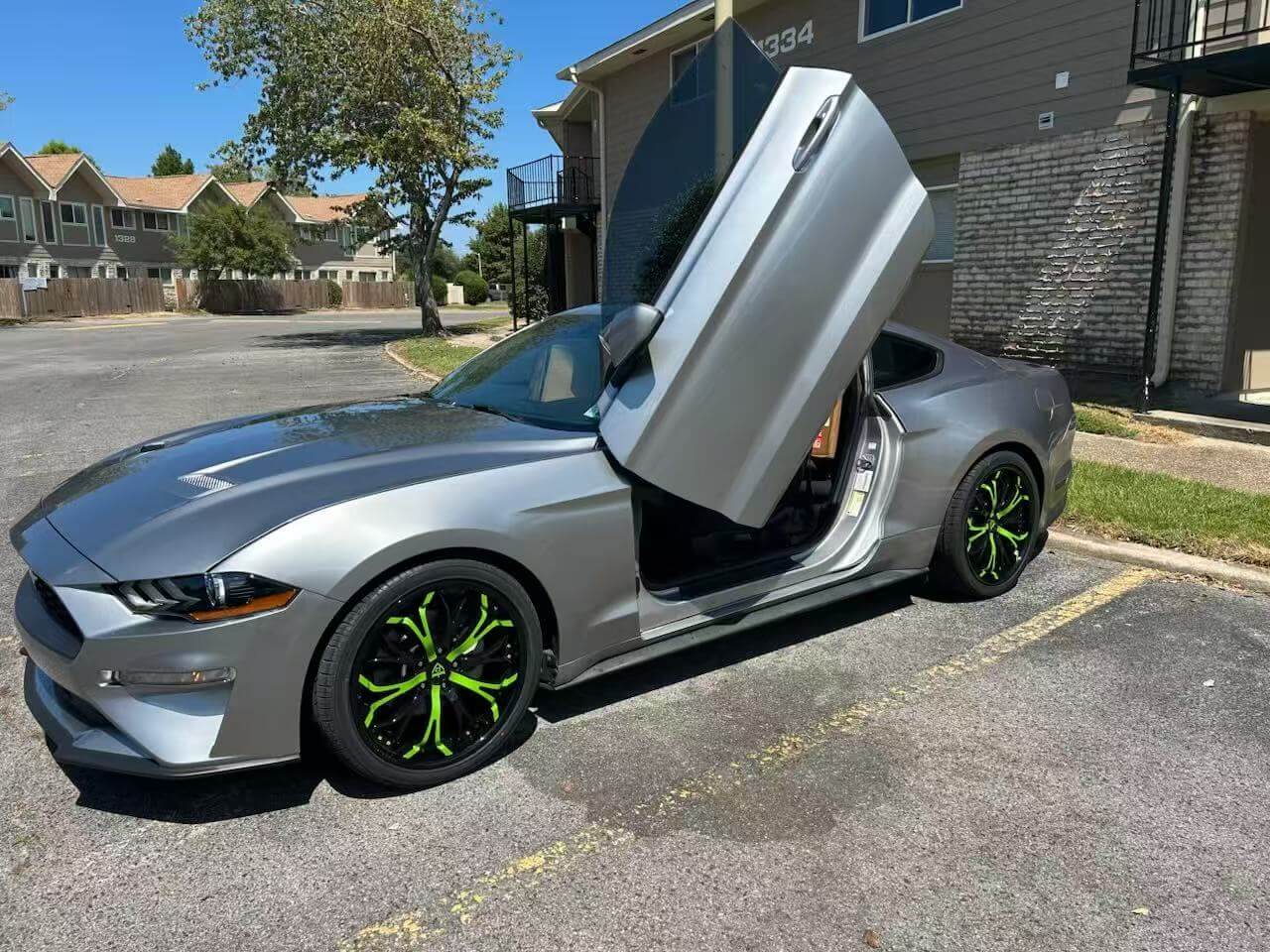 2020 Ford Mustang Ecoboost Premium with custom forged green and black wheels with 20x9 custom setup.