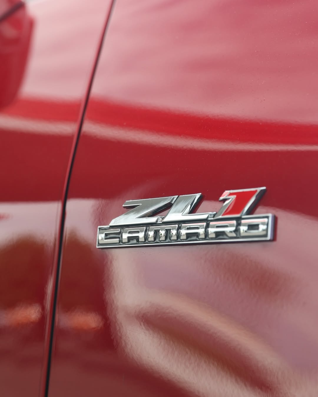 Chrome barrel close-up on custom Camaro wheels