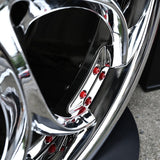 Close-up of custom forged wheels with chrome finish and red accents, ideal for Alfa Romeo Giulia aftermarket rims.