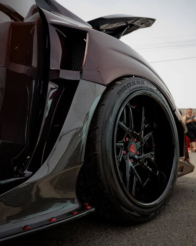 black 2017 Subaru WRX STI with 2-piece forged wheels and wide-body stance.