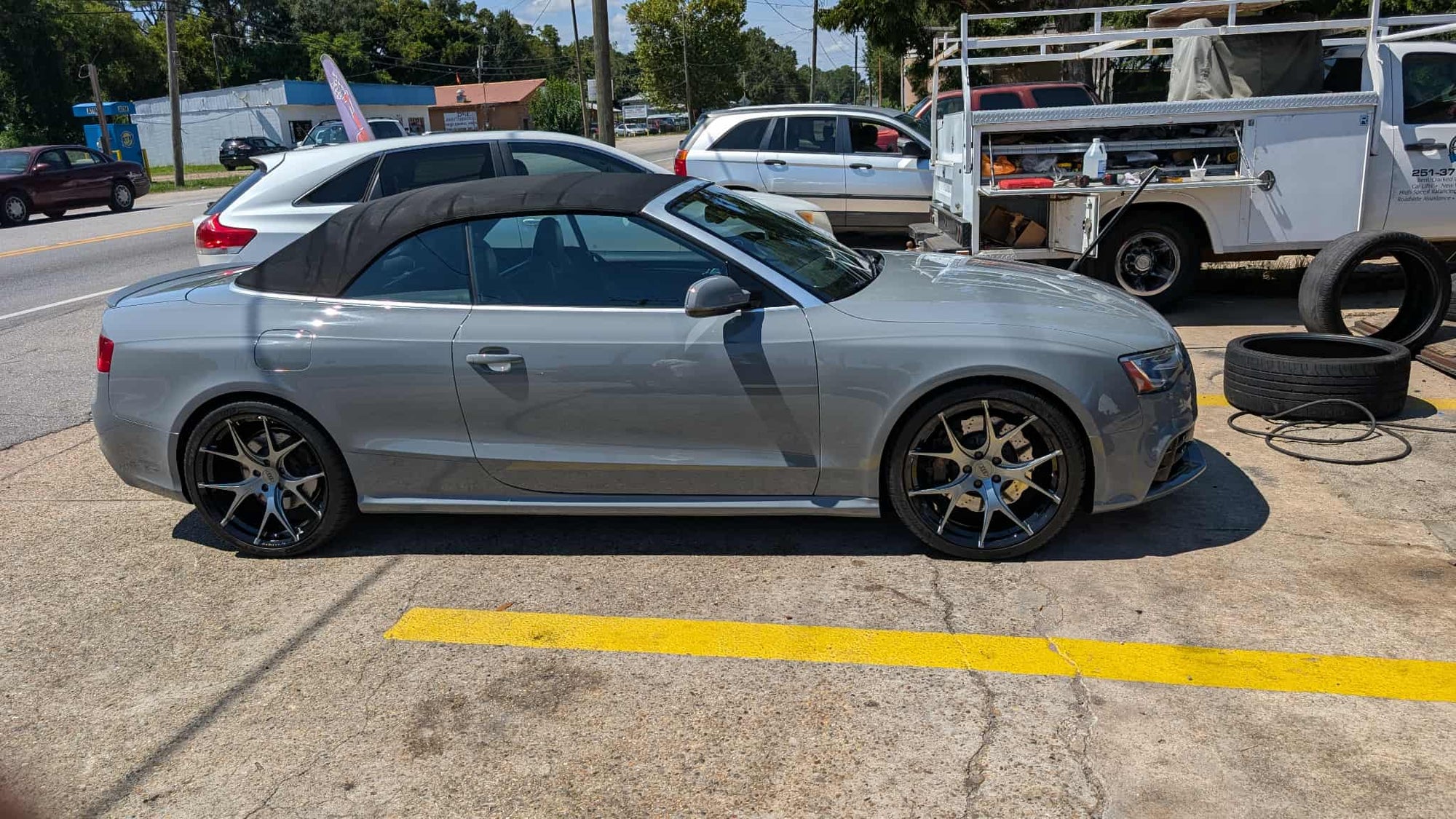 2014 Audi RS5 with custom forged performance wheels and a sleek 20x9 setup parked on the street.