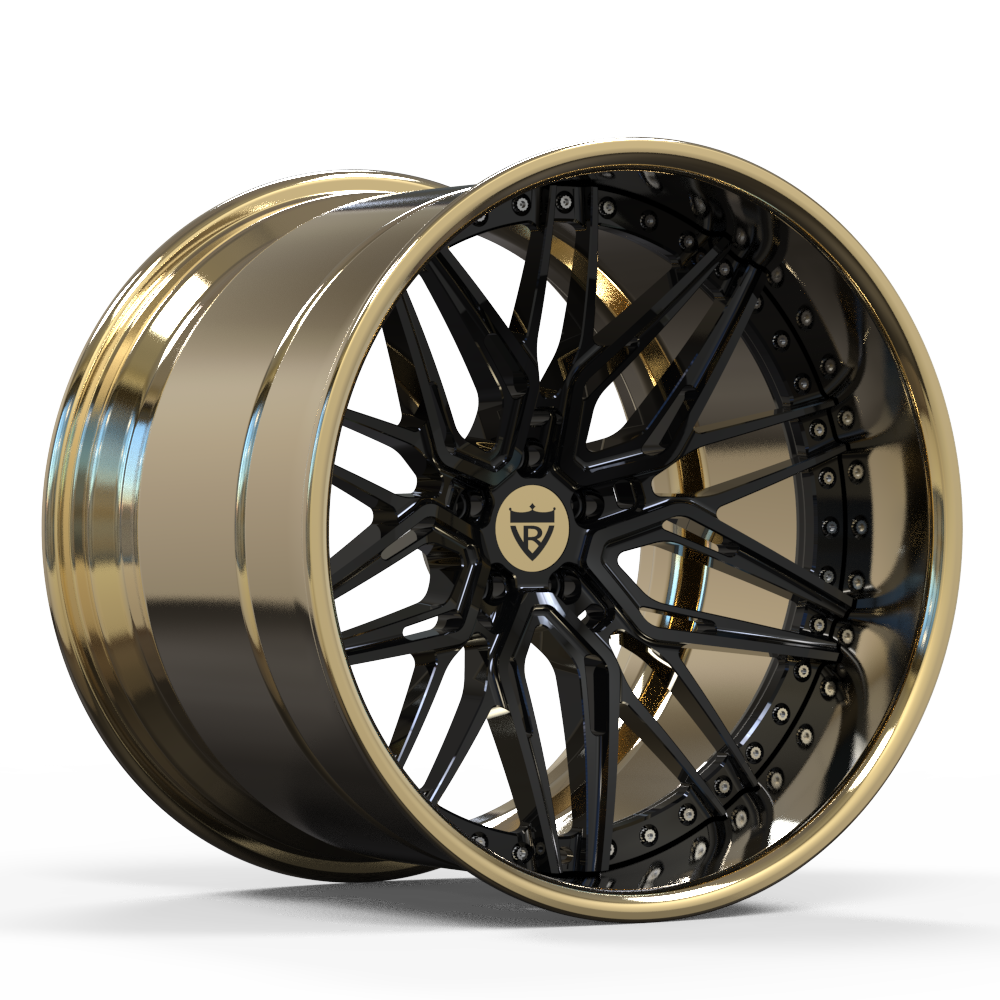 Close-up of the 3-piece forged gold wheels by RVRN, highlighting the intricate wheel design